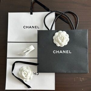 Chanel gift bag with ribbon and wrapping paper